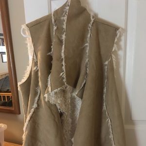 Faux suede vest with faux fur lining.   Never used